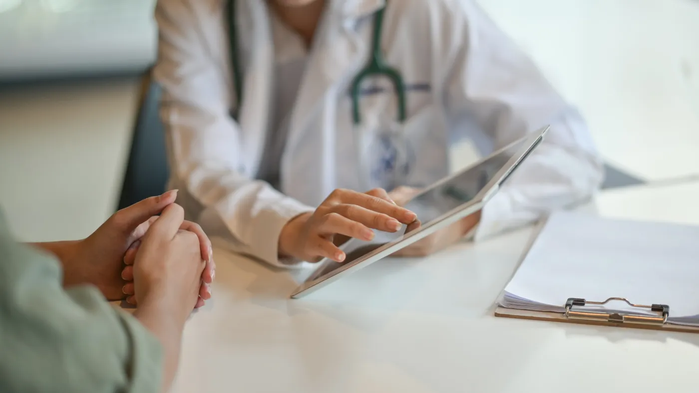 A physician reviewing care options with a patient during an unhurried consultation.